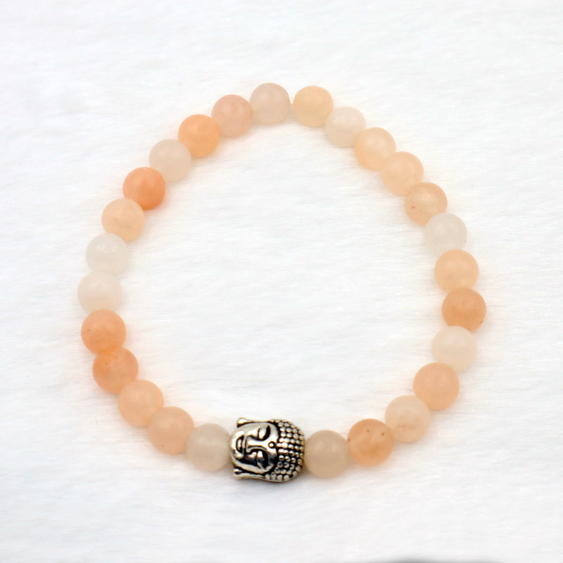 circle bracelet with peach coloured aventurine gemstone beads with silver buddha charm